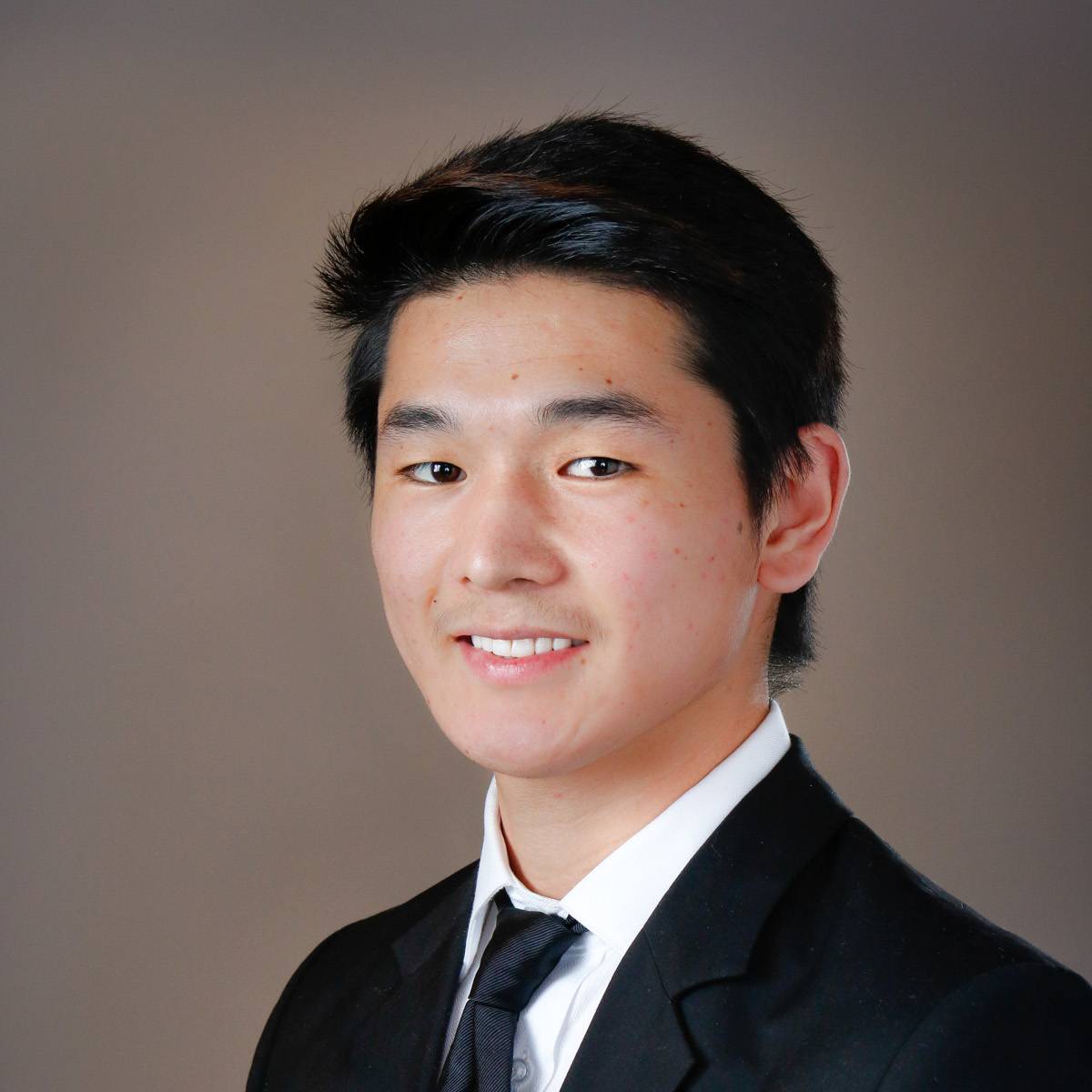 handsome-young-asian-in-a-suit